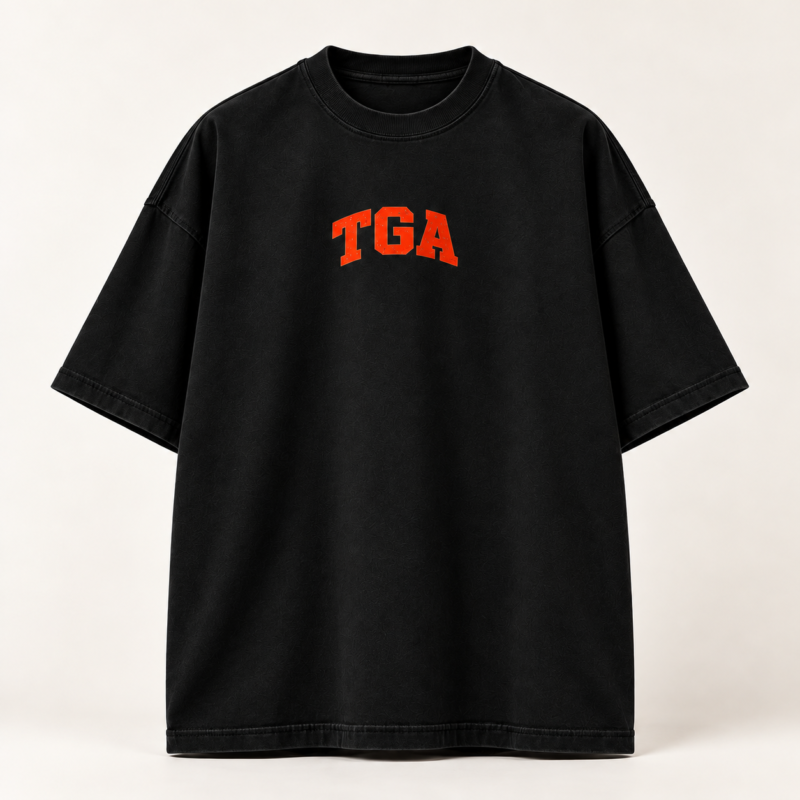 Black oversized T-shirt with orange-red TGA chest print, front view