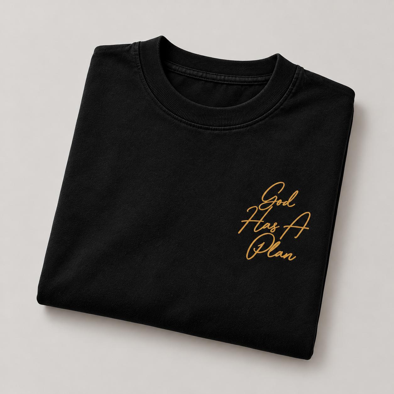 God Has a Plan oversized T-shirt in black, folded view